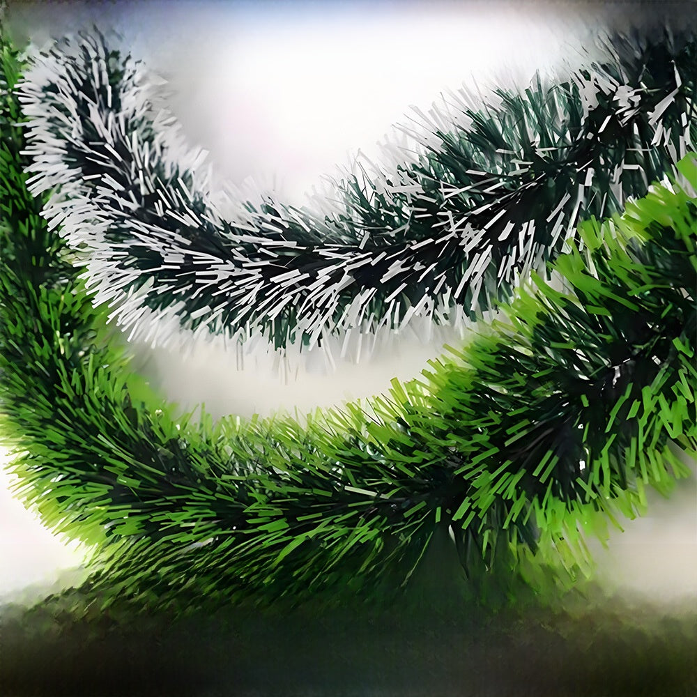 Green and black decorative garland on a white background