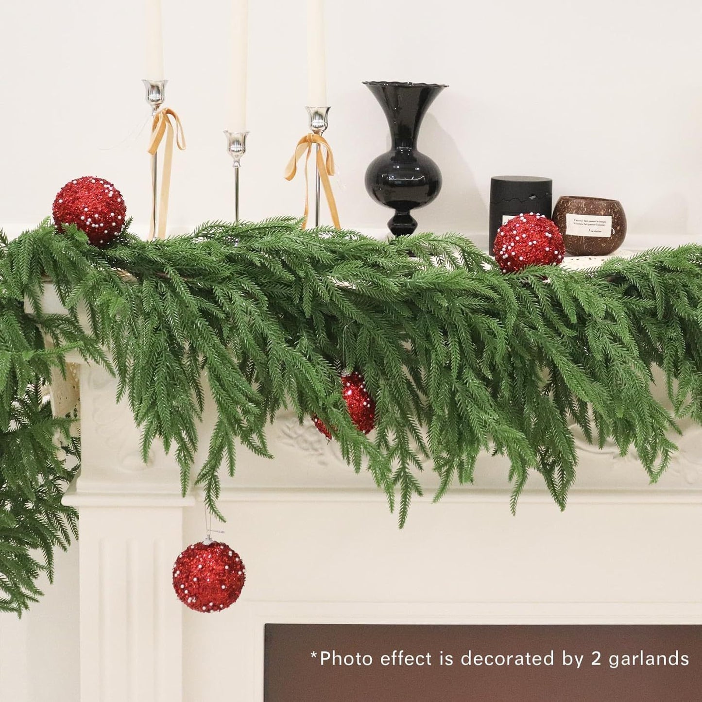Decorative mantel with green garland and red ornaments, featuring a photo effect of two garlands.
