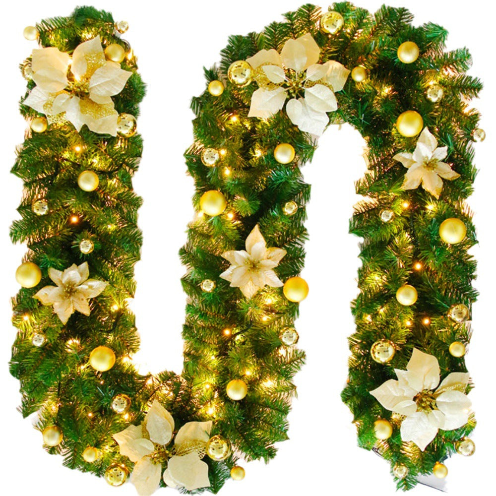 Decorative Christmas garland shaped like the number '10' with lights and flowers on a white background