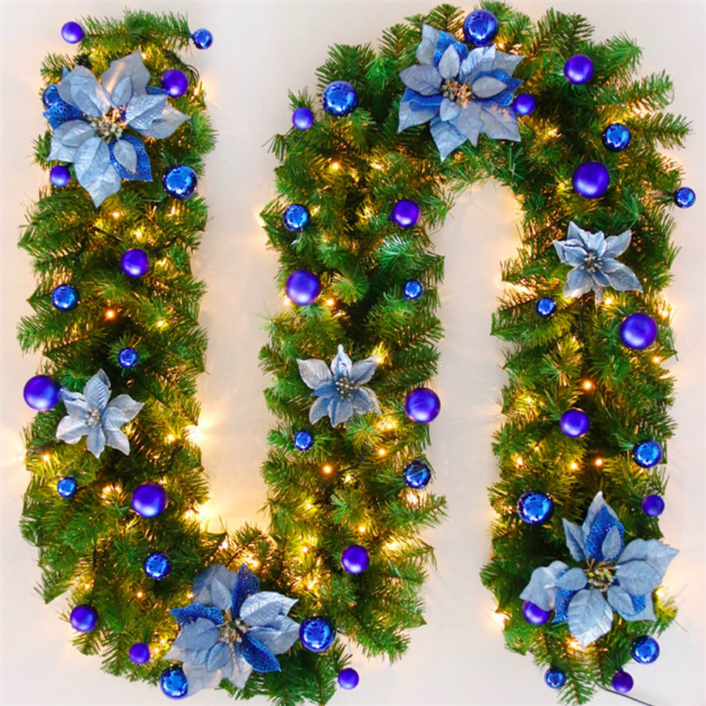 Decorative Christmas garland shaped like the number '10' with blue flowers and lights on a white background.