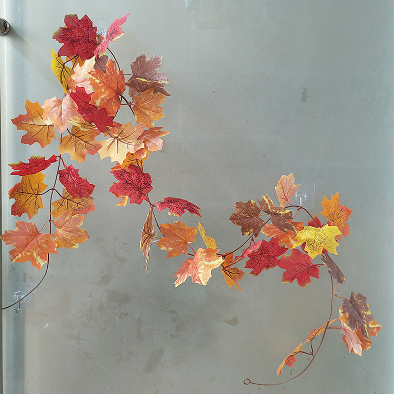 Decorative string of multicolored leaves against a plain background