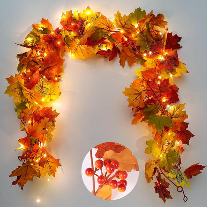 Decorative wreath with autumn leaves and lights on a plain background