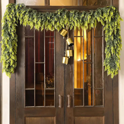 Decorative greenery and gold lanterns on a wooden door