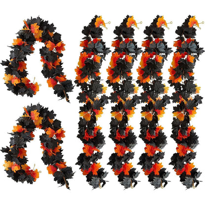 Set of black, orange, and gray leaf garlands on a white background